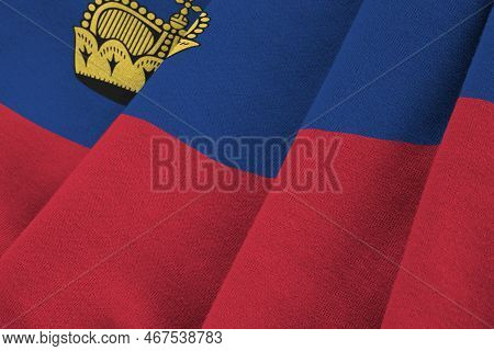 Liechtenstein Flag With Big Folds Waving Close Up Under The Studio Light Indoors. The Official Symbo