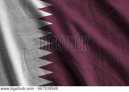 Qatar Flag With Big Folds Waving Close Up Under The Studio Light Indoors. The Official Symbols And C