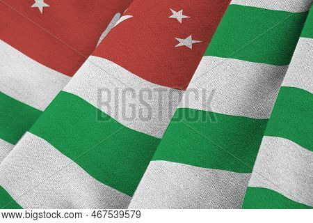 Abkhazia Flag With Big Folds Waving Close Up Under The Studio Light Indoors. The Official Symbols An