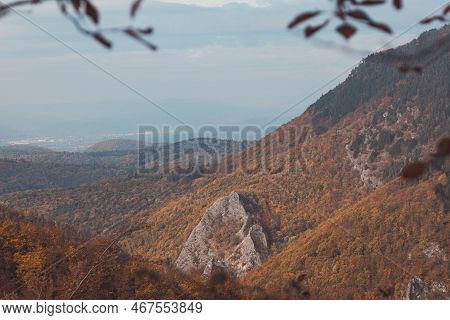 Red And Orange Warm Sun Illuminates The Orange-red Forest And High Rocks. Mojtin, Strazov Mountains,