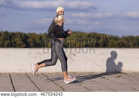 Two Positive Caucasian Runners Athletes Training Together During Running Training Fitness Exercise A