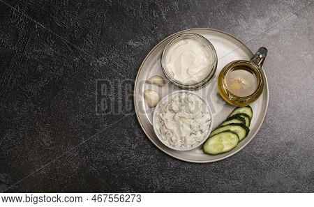 Traditional Greek Yogurt Sauce Tzatziki, Dressing In White Bowl, Made Of Grated Cucumbers, Sour Crea