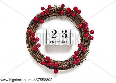 Christmas Wreath Decorated With Red Berries, Wooden Calendar Date 25 December Isolated On White Back