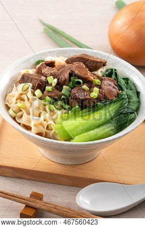 Beef Noodle Soup. Taiwanese Famous Food In A Bowl On Wooden Table.
