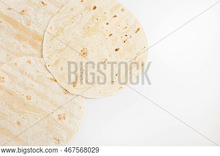 Plain Wheat Tortilla Wraps. Spanish Or Mexican Circular Unleavened Flatbread From Wheat Flour. Ingre