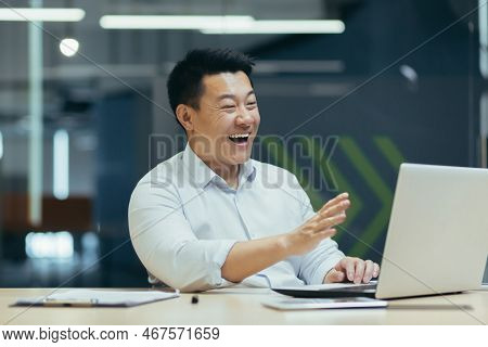 Business Online Meeting. A Young Asian Businessman Holds A Meeting With Partners, Clients, A Confere