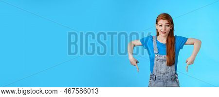Curious Tender Lovely Ginger Caucasian Girl, Pointing Down Questioned, Check Out Interesting Promo, 