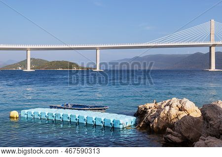 Beautiful Modern Bridge Over The Sea To The Island Of Peljesac In Croatia - Europe. Against The Back