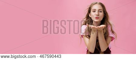 Portrait Of Sensual And Tender Gentle Young Wman With Wavy Natural Hair Bending Towards Camera Facin