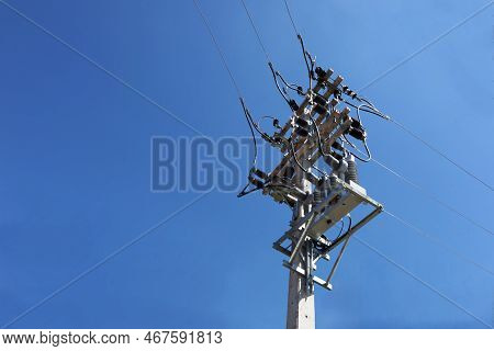 Equipment With Electric Wires On Poles. Recloser Is A Circuit Breaker-like Device Located In A High-
