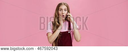 Waist-up Shot Of Shocked Woman Learning Stunning News Via Smartphone Talking On Phone Holding Cellph