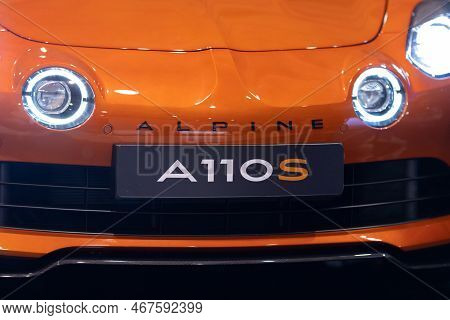 11-17-2022 Lisbon, Portugal - Lisboa Games Week 17 - Orange Sports Car Stands With Headlights On The