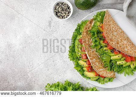 Sandwiches With Salmon, Avocado, Lettuce, Sesame Seeds On White Plate. Flatbread, Healthy Tortilla, 