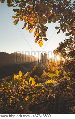 Ruins Of The Old Castle Strecno Illuminated By Sunset Light Towering On A Steep Cliff Surrounded By 