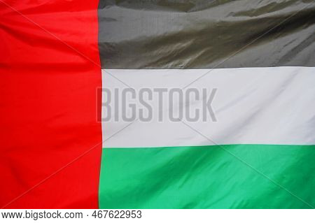 Fabric Texture Flag Of United Arab Emirates. Flag Of United Arab Emirates Waving In The Wind. Flag O