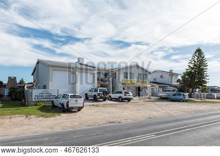 Struisbaai, South Africa - Sep 21, 2022: Street Scene, With Businesses And Vehicles, In Struisbaai, 