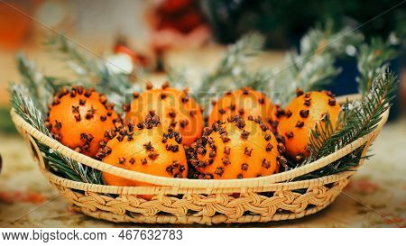 Oranges With Cinnamon Stars On The Christmas Table