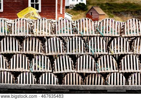 Wooden Lobster Traps Stacked On A Boat Dock Near The Small Fishing Village Of Trinity Newfoundland C