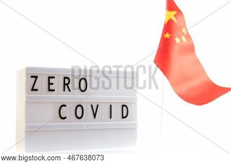 Zero Covid Inscription On A Dark Background With A Chinese Flag. Protest And Cancel Quarantine