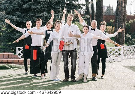 Group Of Happy Restaurant Employees Standing Togethe