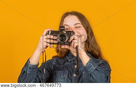 Happy Teenage Girl Photographer Looking Into Camera Yellow Background, Photographing