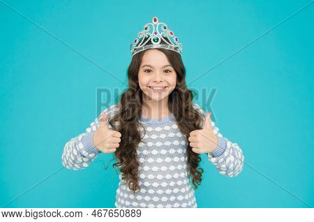 Promoting Your Content. Happy Child Give Thumbs Ups Blue Background. Princess Girl Wear Crown. Promo