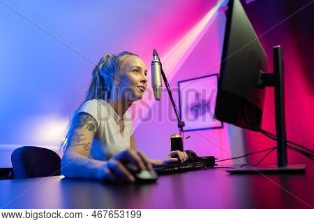 Beautiful Professional Gamer Girl Streams And Play Online Multiplayer Video Game On Pc