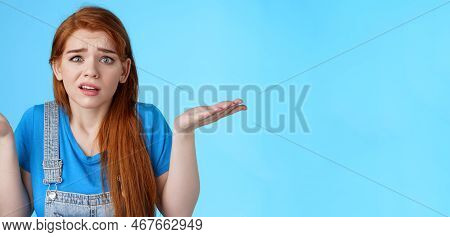 Perplexed Uneasy Stupified Worried Redhead Woman Shrugging, Have No Idea, Frowning Nervously, Cannot