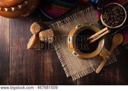 Authentic Homemade Mexican Coffee (cafe De Olla) Served In Traditional Handmade Clay Mug (jarrito De