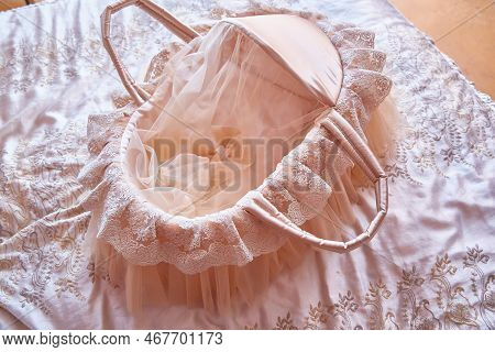 Beautiful Carrycot Or Cradle With Lace And Ribbons For A Newborn Baby.