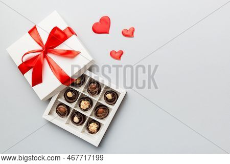 Delicious Chocolate Pralines In Red Box For Valentine's Day. Heart Shaped Box Of Chocolates Top View