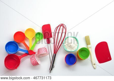 Top View Set Of Kitchen Utensils And Ingredients For Bakery On White Background. Materials Or Kitche