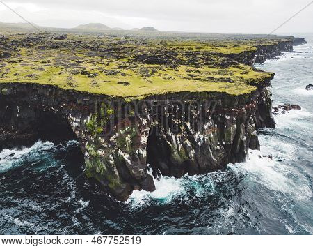Spectacular Black Volcanic Rocky Ocean Coast With Cave Arch And Towers - Iceland