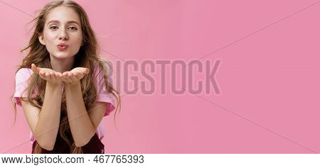 Portrait Of Sensual And Tender Gentle Young Wman With Wavy Natural Hair Bending Towards Camera Facin