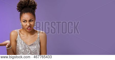 Arrogant Peeky African-american Woman In Shiny Luxurious Dress Cringing Aversion Wave Away Dislike A