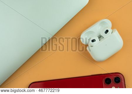 Bangkok, Thailand - December 24, 2022 : Airpods 3 Generations With Iphone 11 And Macbook Pro. Headph