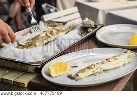 Roasted Branzino Or Sea Bass Filleted At A Table, Vernazza, Cinque Terre Italy