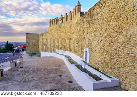 Medieval Wall And Source Of Fresh Water In The Picturesque Town Of Medina Sidonia, Cadiz.