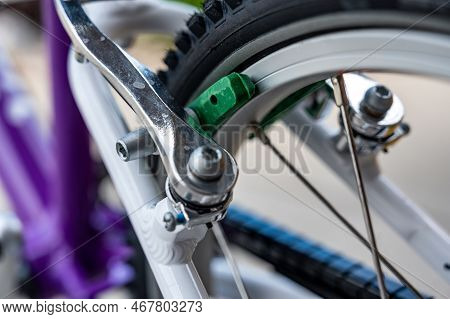 Selective Focus On Peddle Bike Brake Pads On Back Tire Rim