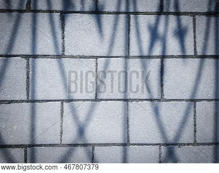 Close Up. Shadow On The White Pavement Tile