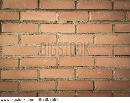 Close Up. A Fragment Of A Red Brick Wall.