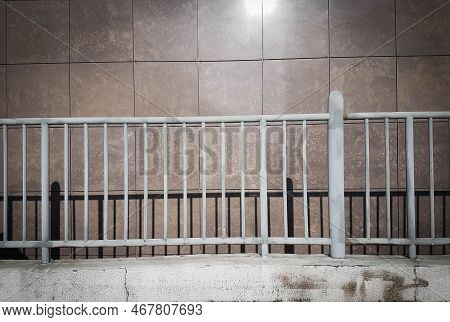 Close Up. Metal Railing Near The Wall.