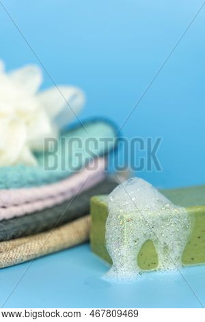 Olive Oil Soap With Soap Foam On Blue Table And Background.side View.
