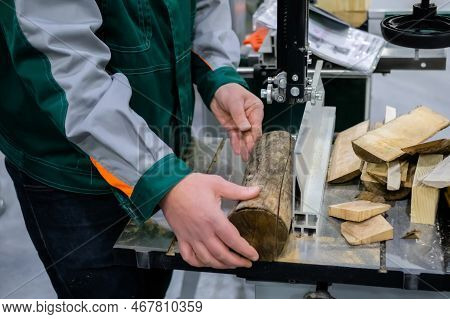 Professional Man Carpenter Using Electric Bandsaw Tool, Cutting Piece Of Wood At Workshop. Design, C