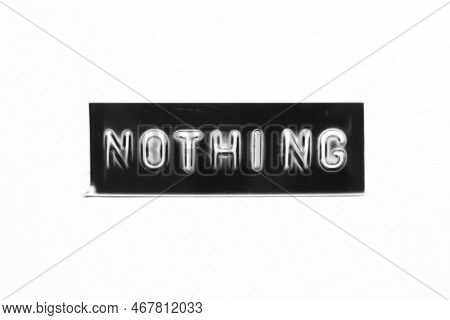 Black Color Banner That Have Embossed Letter With Word Nothing On White Paper Background