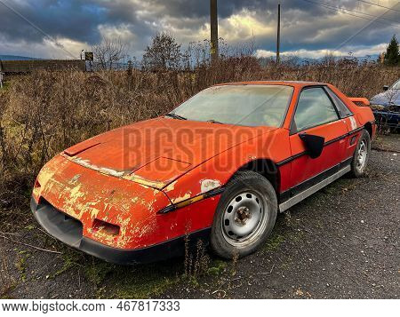 Miercurea Ciuc, Romania- 25 December 2022: Old , Abandoned Pontiac Fiero Near Roadside.