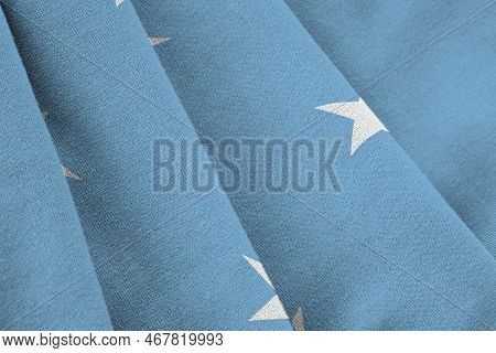 Micronesia Flag With Big Folds Waving Close Up Under The Studio Light Indoors. The Official Symbols 