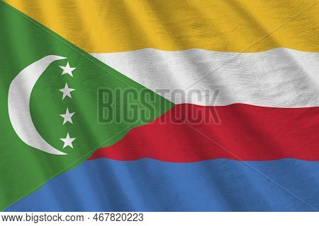 Comoros Flag With Big Folds Waving Close Up Under The Studio Light Indoors. The Official Symbols And