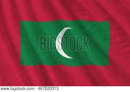 Maldives Flag With Big Folds Waving Close Up Under The Studio Light Indoors. The Official Symbols An