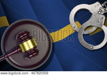 Nauru Flag With Judge Mallet And Handcuffs In Dark Room. Concept Of Criminal And Punishment, Backgro